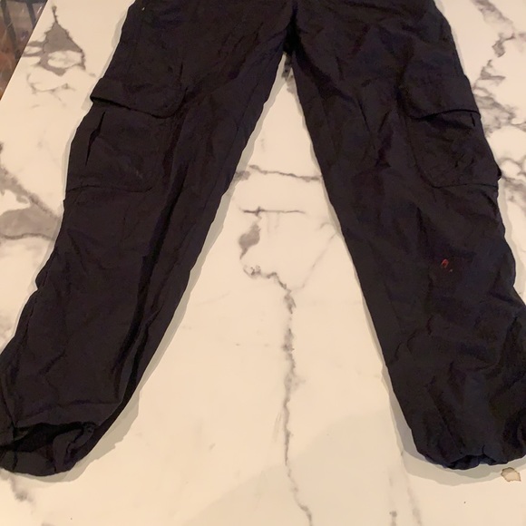 These are black cargo pants from ninth hall. size small, comfortable ,100% nylon - Picture 2 of 5